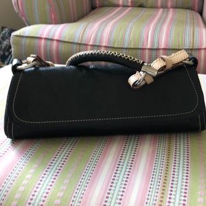 Dimoni leather handbag purchased in England.